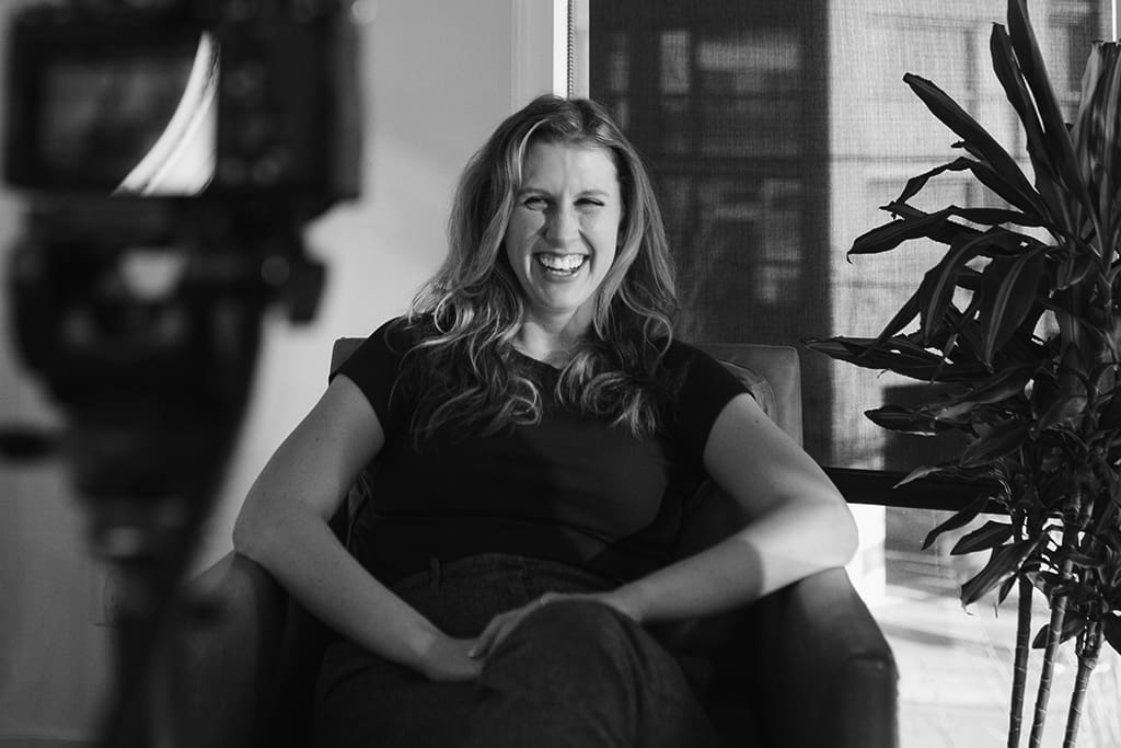 danielle allan laughing in an armchair